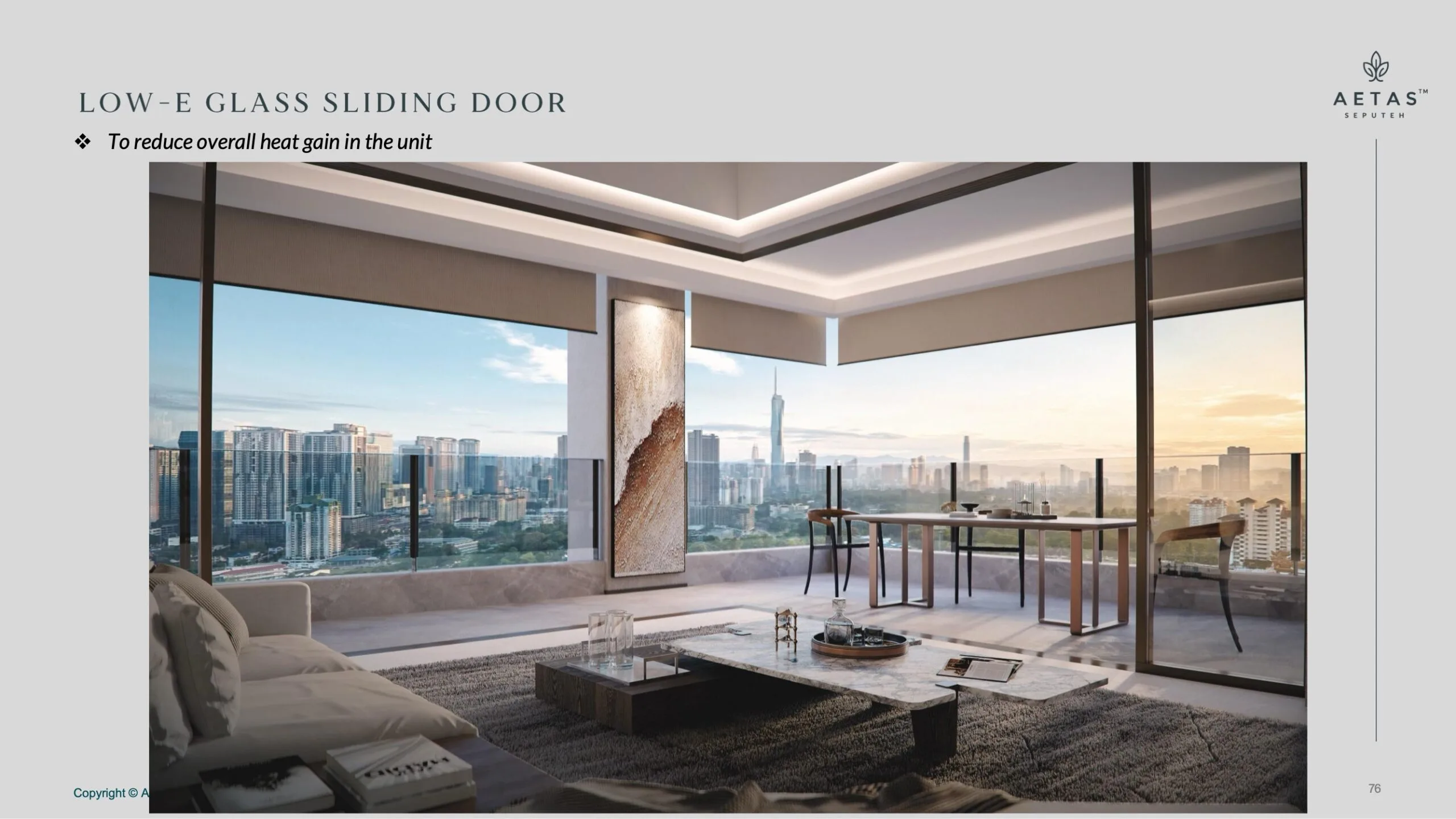 Aetas Seputeh living and dining room with low-E glass sliding doors opening to a balcony city view