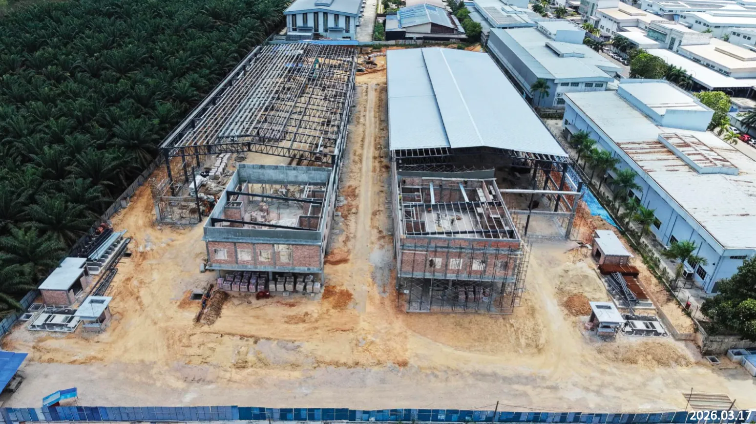 Foto udara kemajuan pembinaan Alpha Austin Industrial Park, Mac 2026, Tanjung Langsat