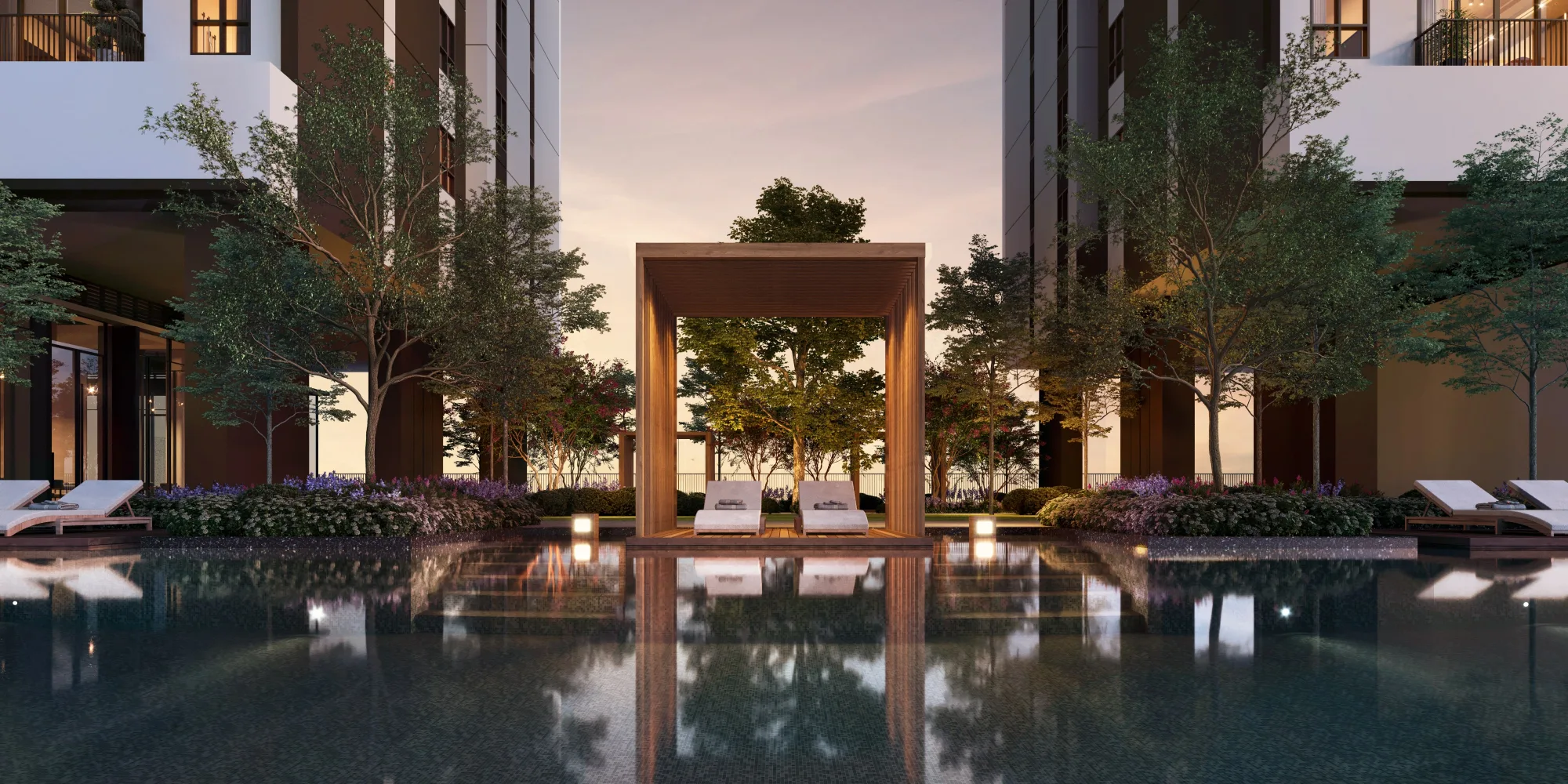 Aras Residence OUG podium infinity pool deck at dusk with timber pergola cabana and poolside loungers