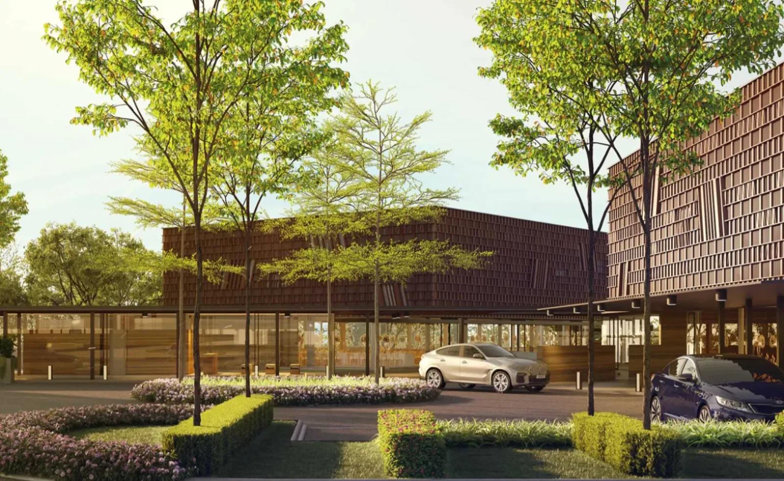 Eksterior Aurora Clubhouse dengan fasad kekisi kayu dan kawasan drop-off berlandskap di Aurora Resort Villas, Iskandar Puteri