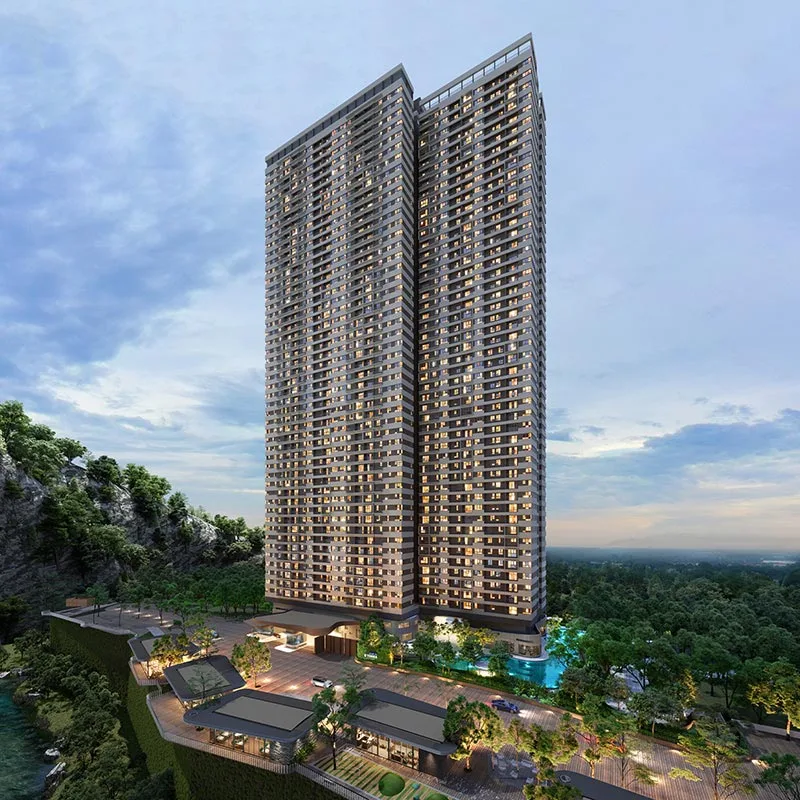 Aerial twilight view of D'Terra Residences twin towers set against the Central Park Damansara cliffside, Selangor