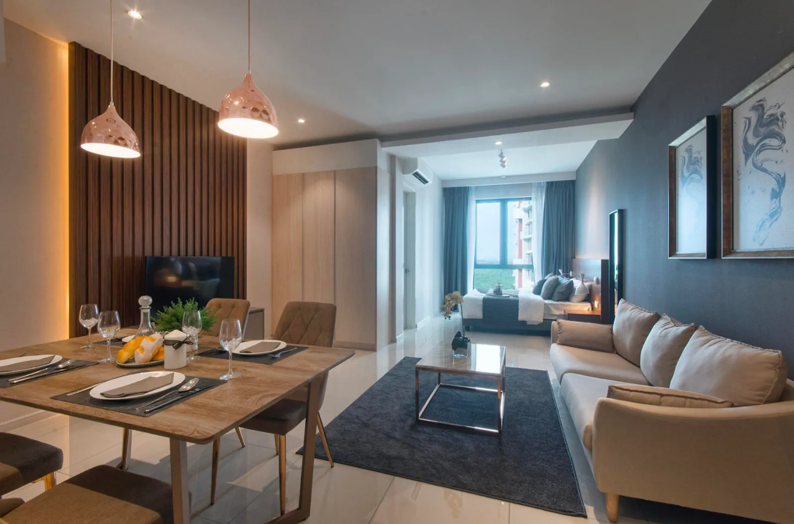 Hiasan dalaman unit studio berperabot penuh di Elysia Park Residence dengan ruang makan, tamu dan tidur pelan terbuka
