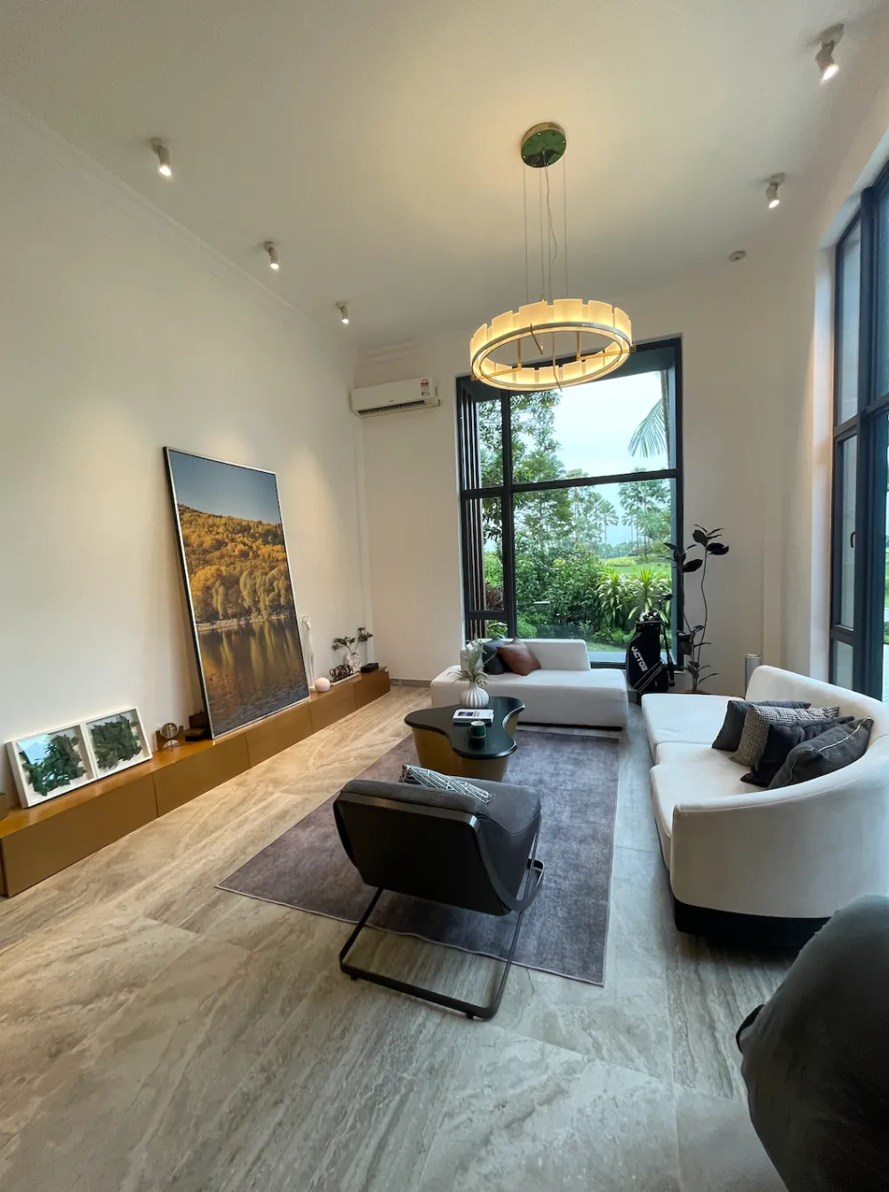 Forest City Golf Villa (Garden Terrace) Forest City Golf Villa show villa living room with floor-to-ceiling windows overlooking the golf course in Forest City Golf Resort, Gelang Patah, Johor