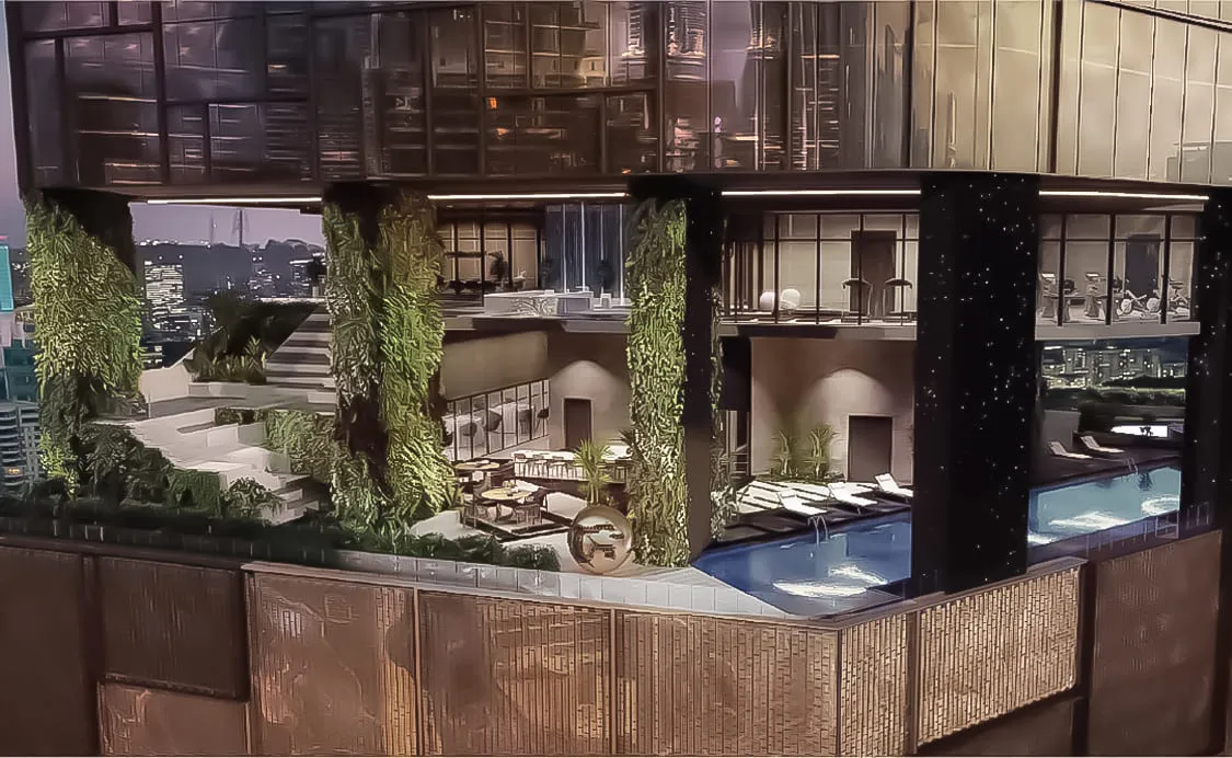 Orion Residence night aerial view of rooftop facilities deck with pool terrace, vertical green wall, and city skyline, from the official developer website in Bukit Bintang, Kuala Lumpur