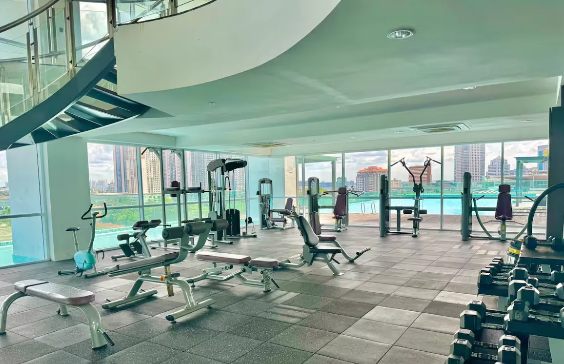 Paragon Suites @ CIQ two-storey glass-walled gymnasium with full-height city view windows in Stulang Laut, Johor Bahru City Centre, Johor