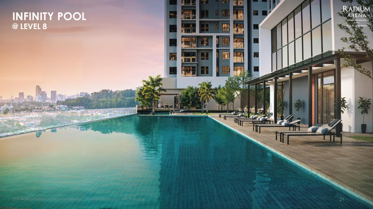 Radium Arena Level 8 infinity pool with sun loungers and Kuala Lumpur skyline view at sunset in Old Klang Road, Kuala Lumpur