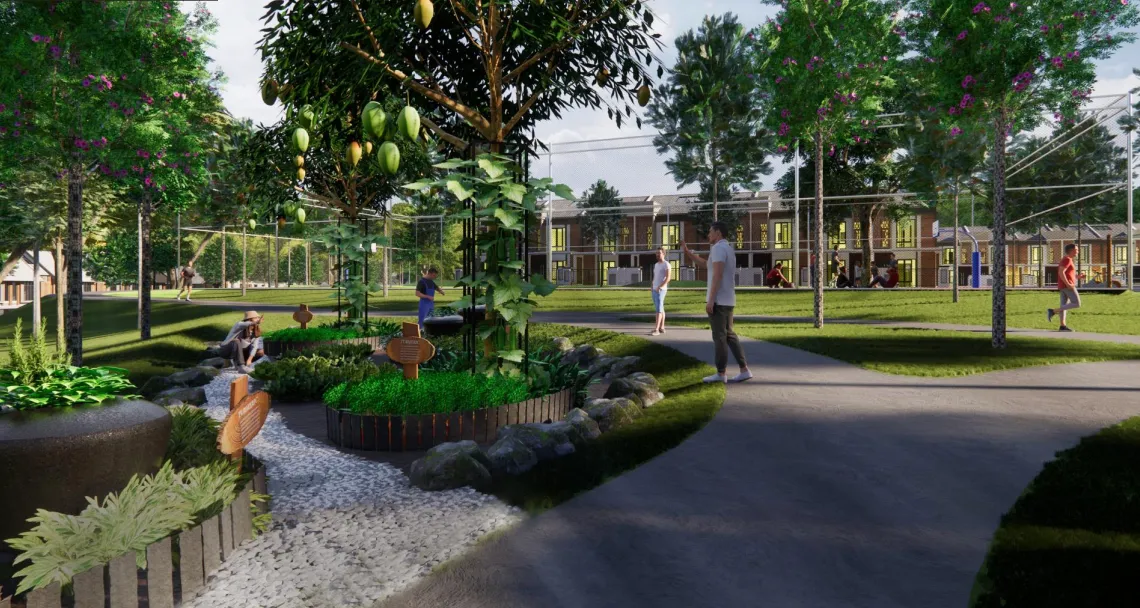 Taman komuniti tanaman boleh dimakan dengan pokok buah berlabel dan laluan bersimbahkan batu di Central Park Sanubari