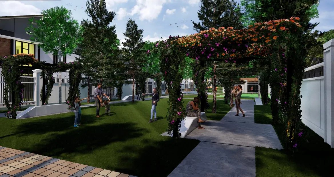 Laluan pergola bertutup tanaman menjalar berbunga yang menghubungkan padang taman di taman komuniti Sanubari
