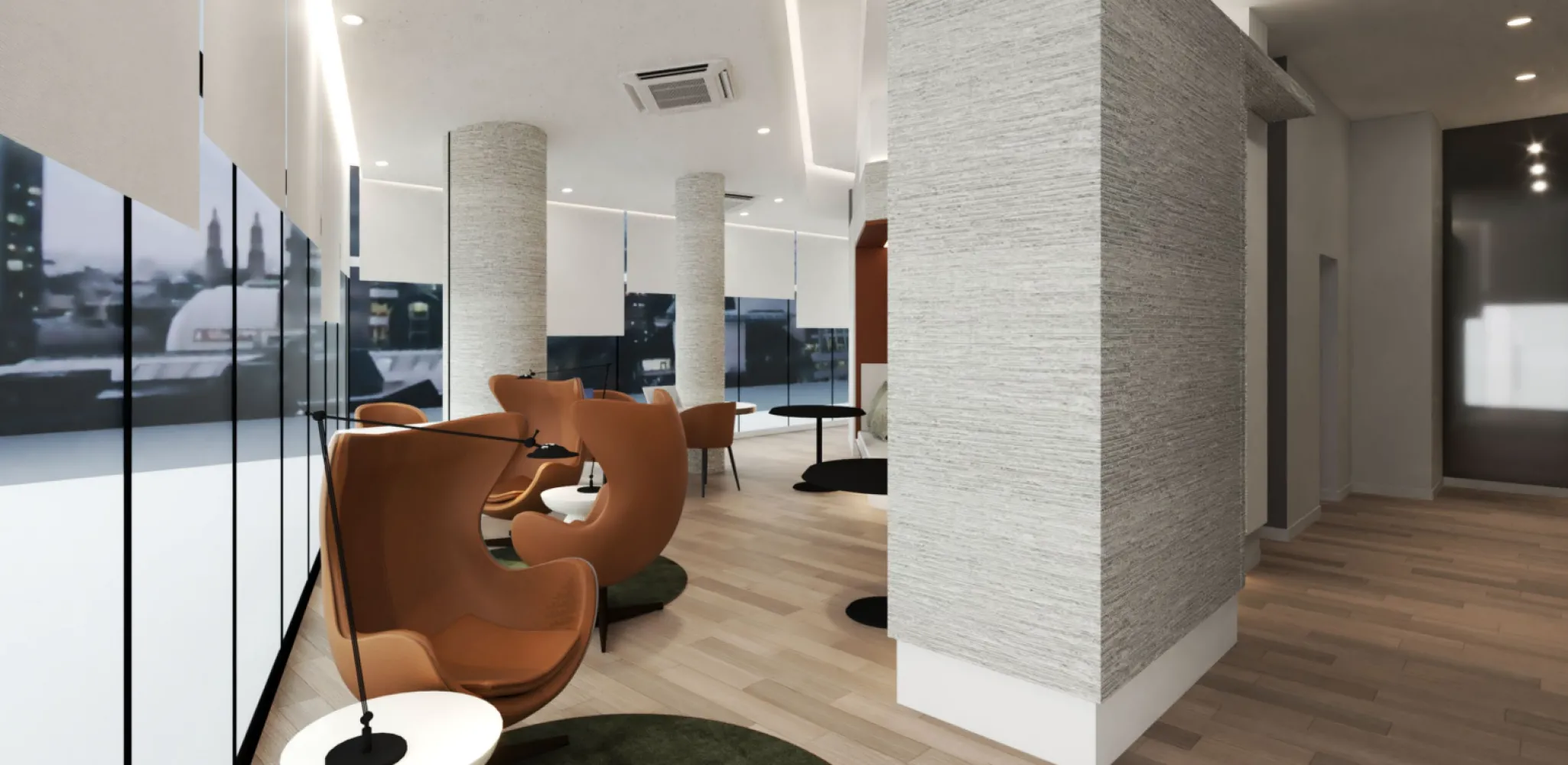 Lounge kerja bersama Solarvest Suites dengan tempat duduk lounge kuning tanah dan tingkap setinggi penuh menghadap Bangsar South