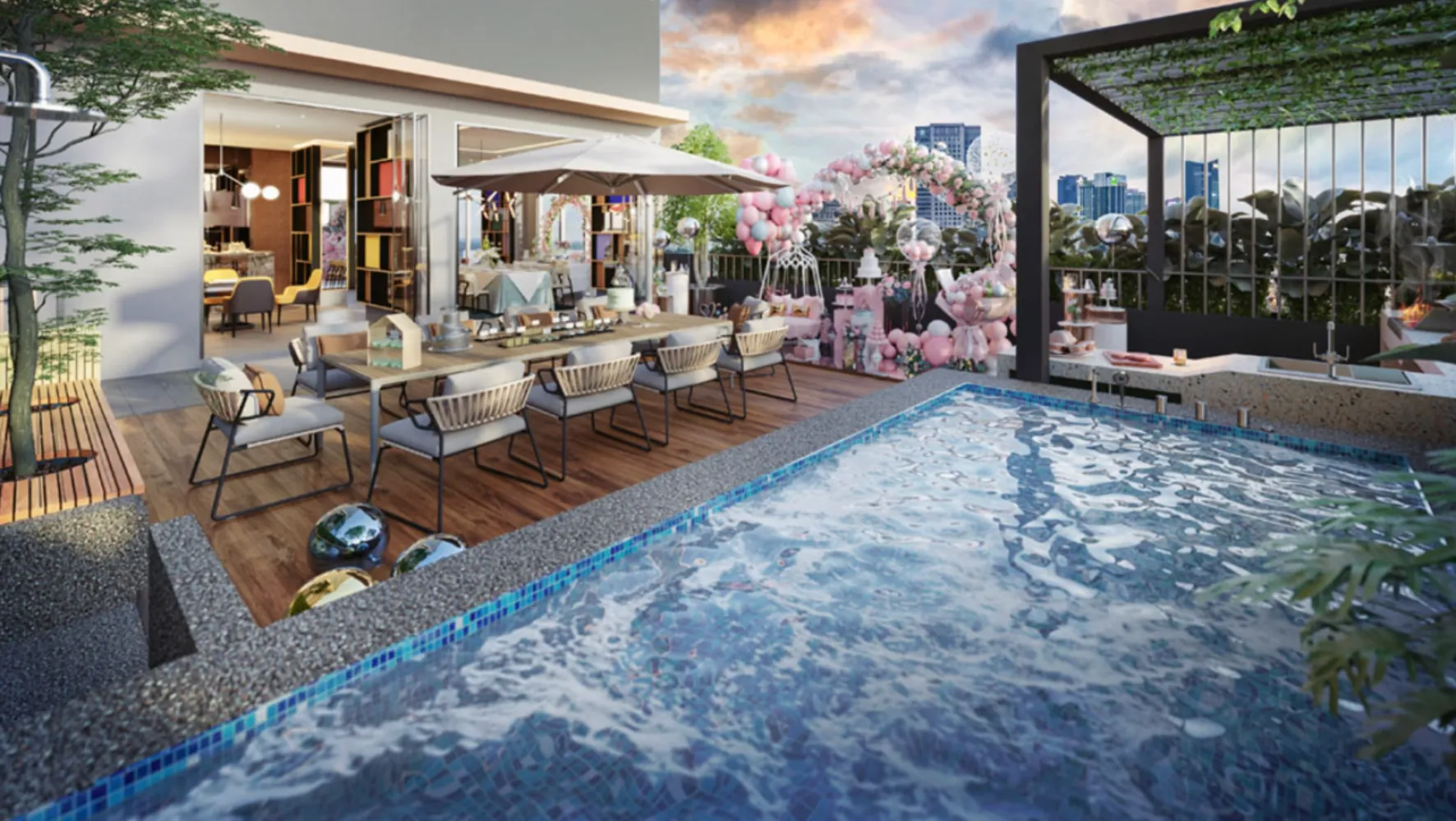 Dek kolam renang bumbung Summer Suites dengan susunan makan alfresco dan pemandangan bandar Johor Bahru