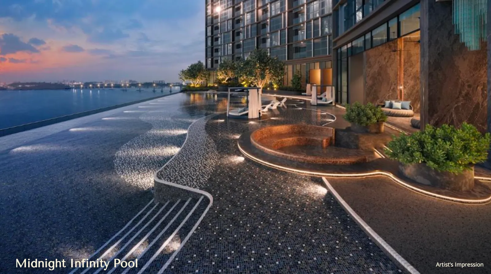 Dek kolam renang infiniti The Eclipse pada waktu senja dengan kerusi santai, ruang legar tenggelam dan tepi kolam menghadap Selat Johor