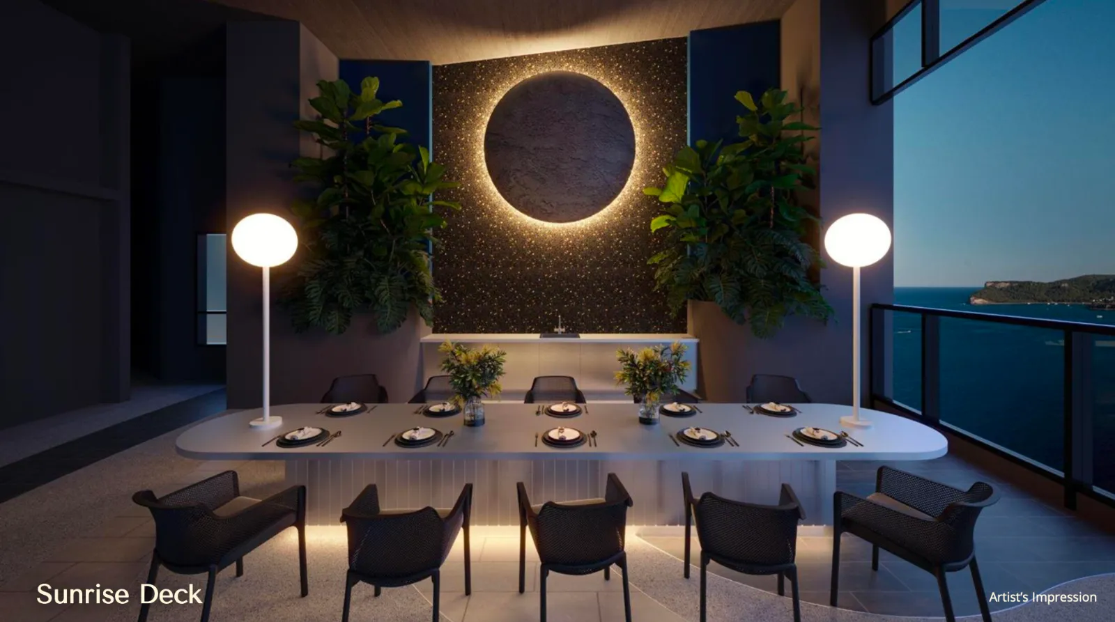 Meja makan komuniti Sunrise Deck The Eclipse pada waktu senja dengan ciri seni bermotif gerhana bulat dan balkoni menghadap laut