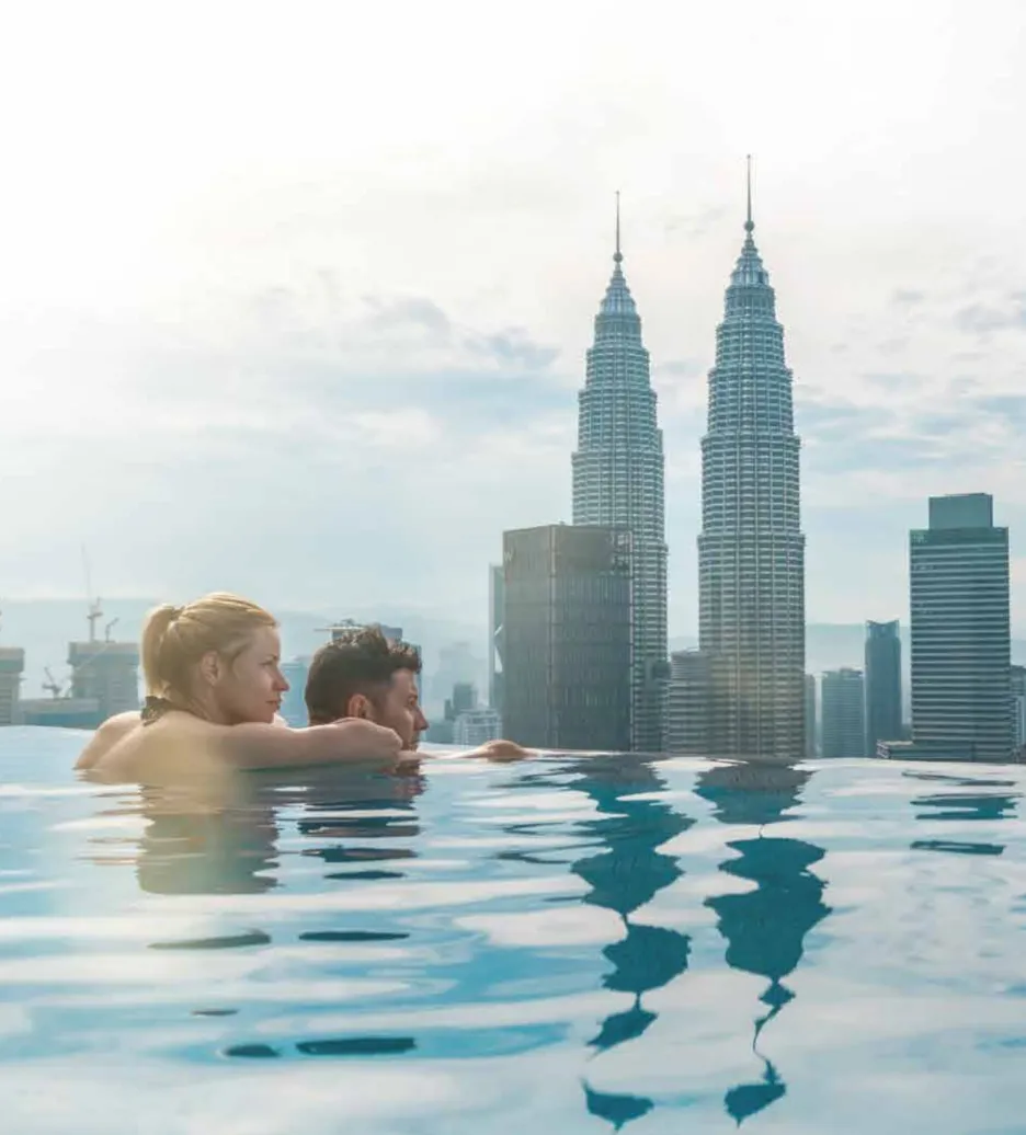 THE FACE Suites @ KLCC rooftop infinity pool with Petronas Twin Towers skyline view