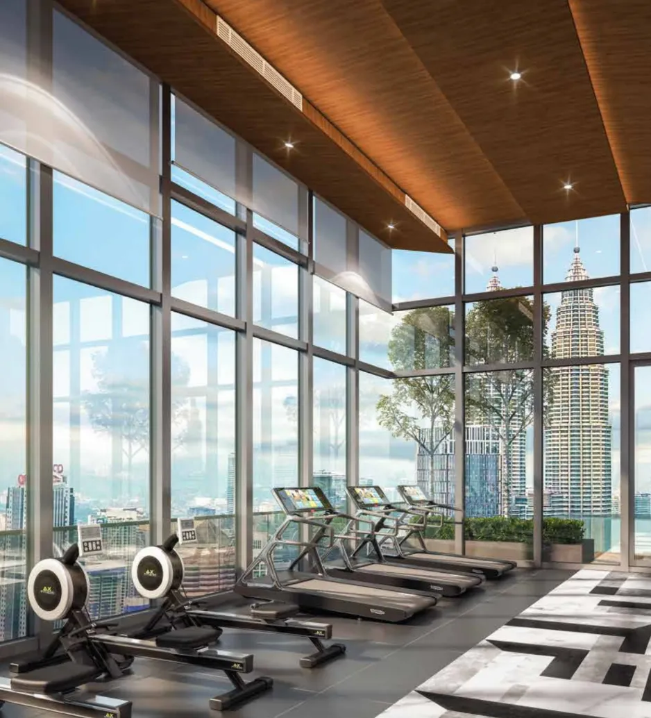 THE FACE Suites @ KLCC sky gym fitness centre with floor-to-ceiling KLCC skyline view