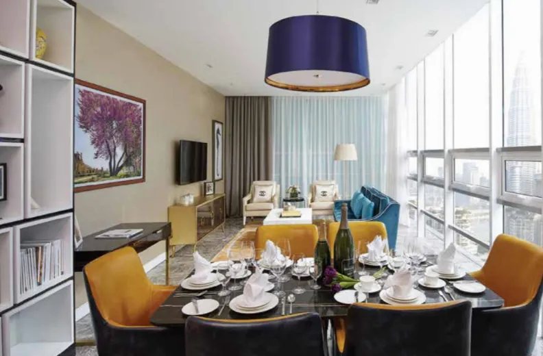 THE FACE Suites @ KLCC furnished suite dining area with Petronas Twin Towers view