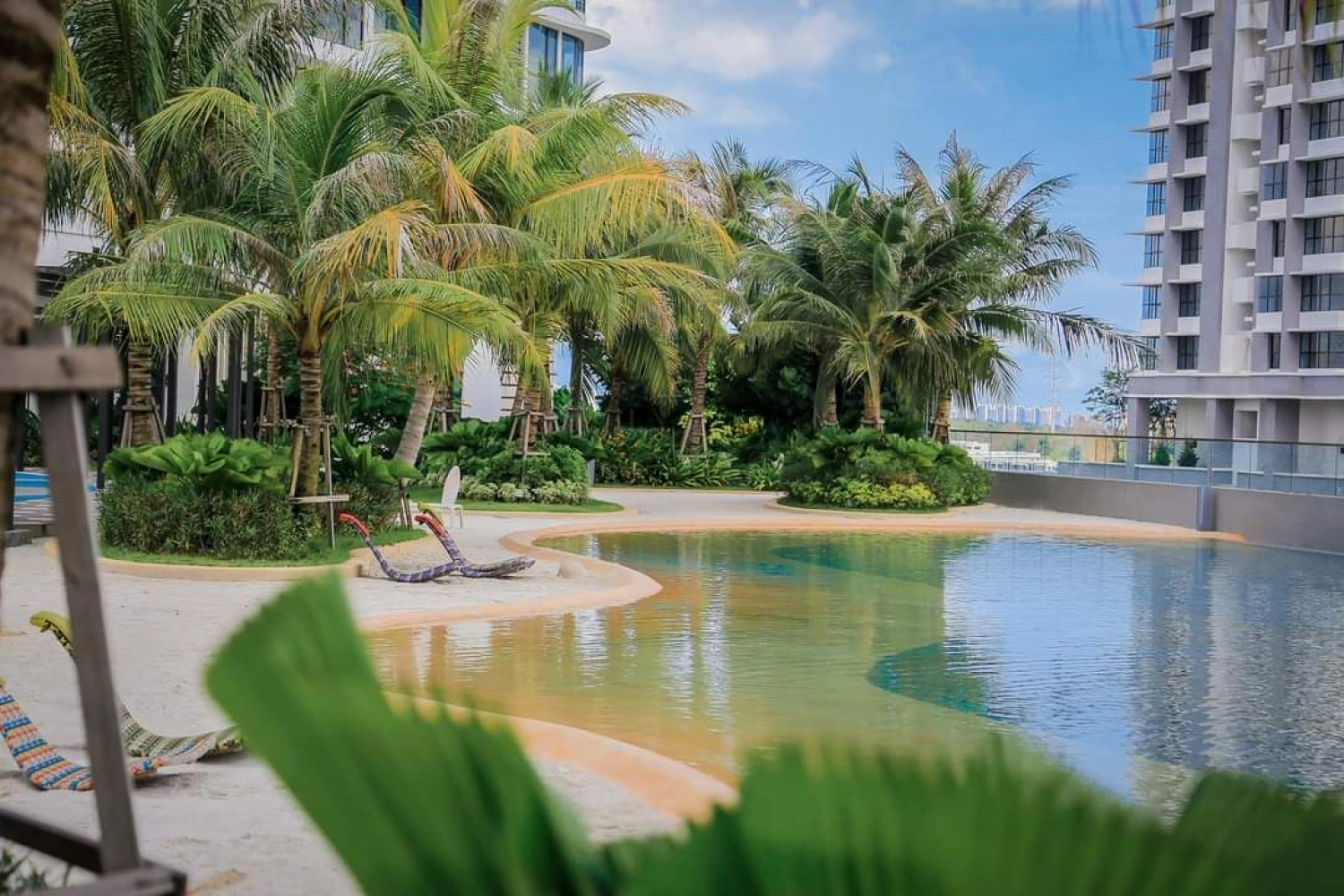 The M Macrolink Medini lagoon-edge pool with landscaped garden and daybeds in Medini, Iskandar Puteri, Johor