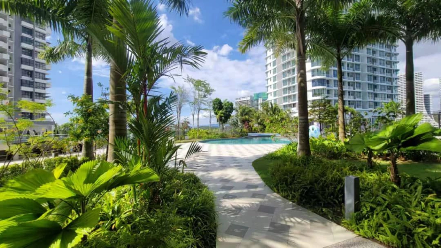The M Macrolink Medini pool deck with direct tower view and loungers in Medini, Iskandar Puteri, Johor