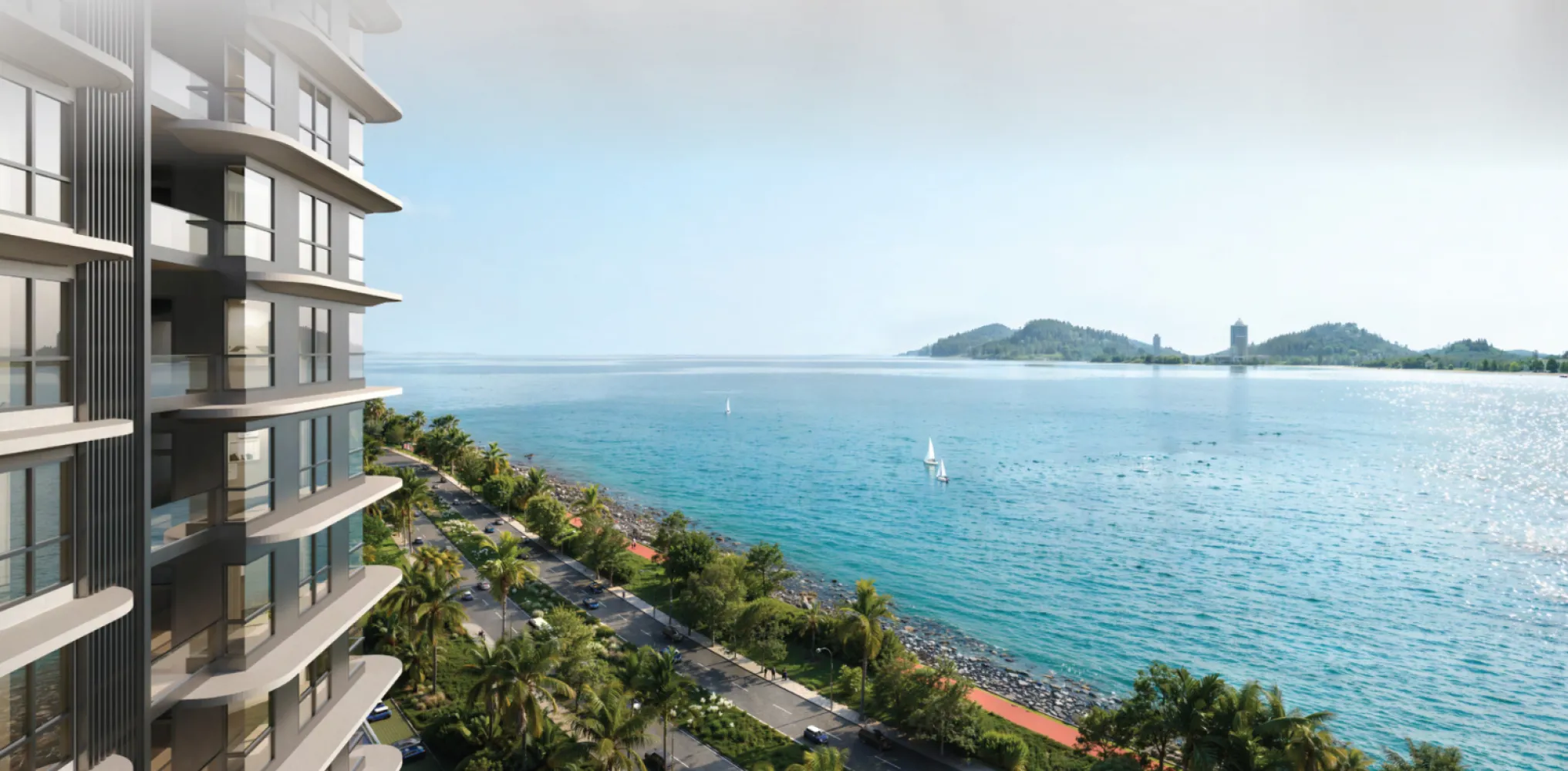 The V by Jesselton balcony view along the Likas Bay coastal road with sailboats and hills in the distance in Likas Bay, Kota Kinabalu, Sabah