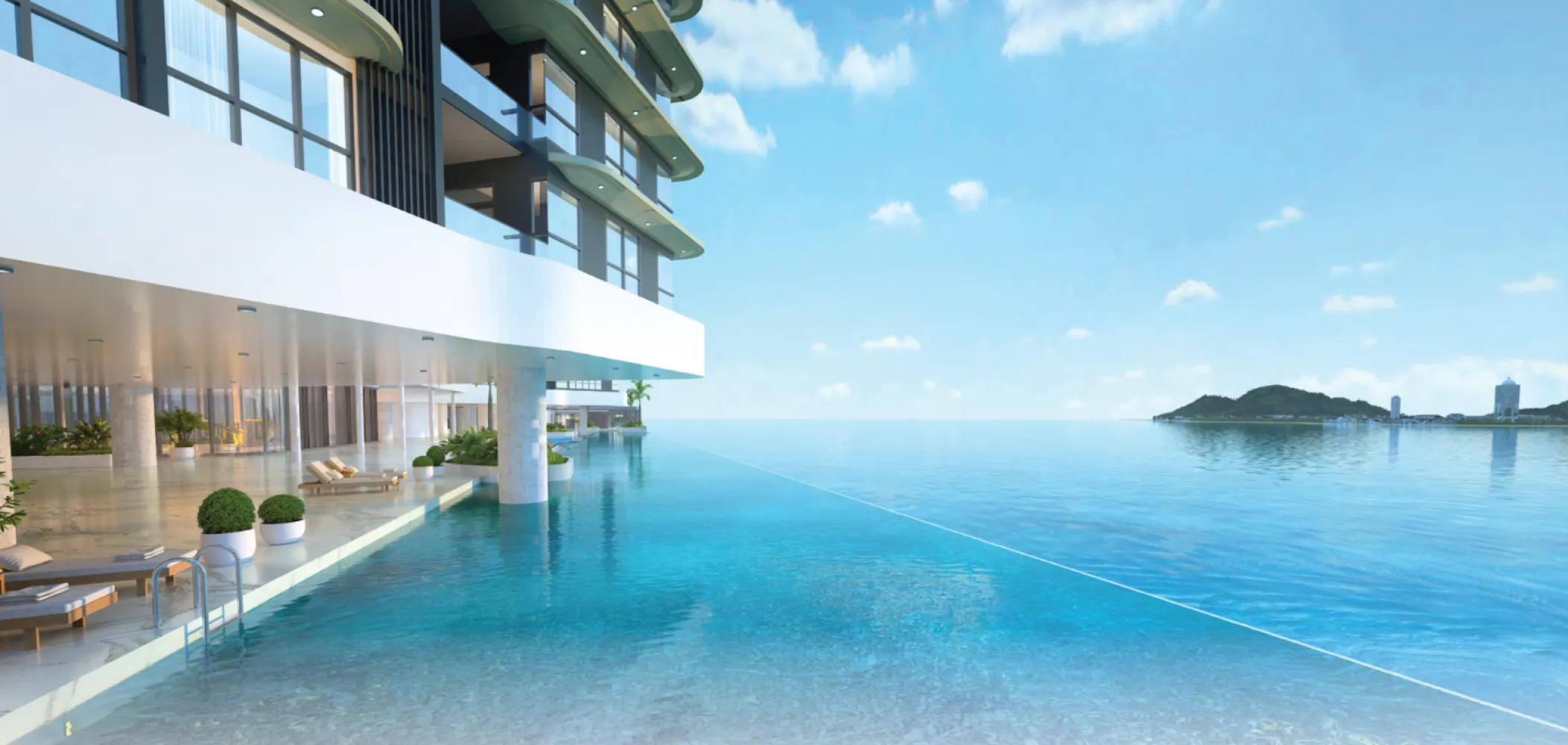 The V by Jesselton 100-metre infinity pool deck with direct sea views over Likas Bay in Likas Bay, Kota Kinabalu, Sabah