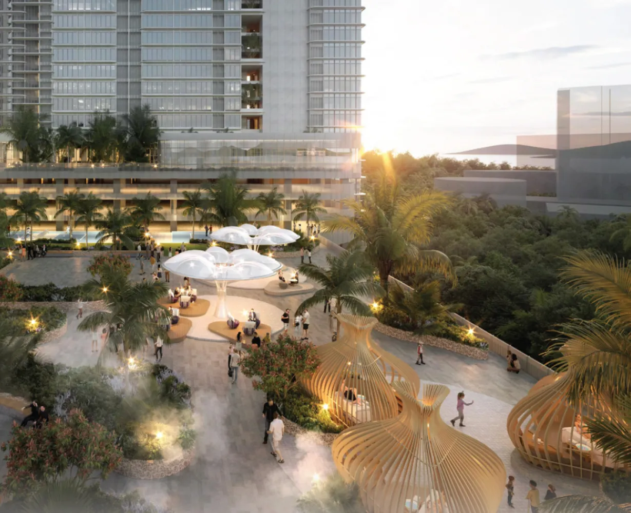 The V by Jesselton landscaped lifestyle plaza with sculptural seating pods and tropical planting at dusk in Likas Bay, Kota Kinabalu, Sabah