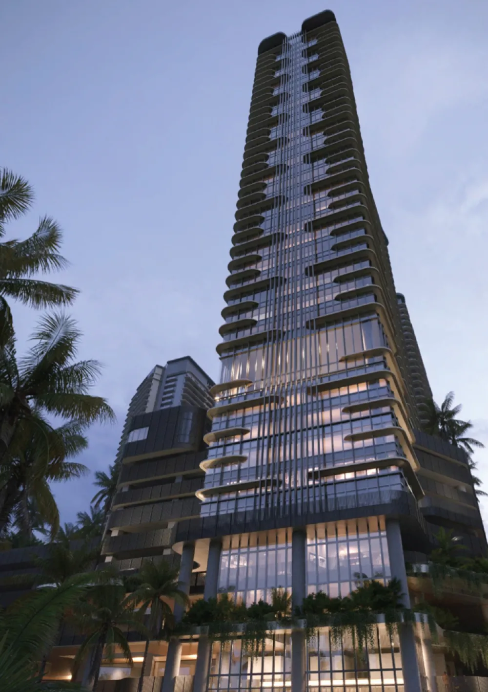 The V by Jesselton residential tower silhouette at dusk with landscaped palm-lined podium below in Likas Bay, Kota Kinabalu, Sabah