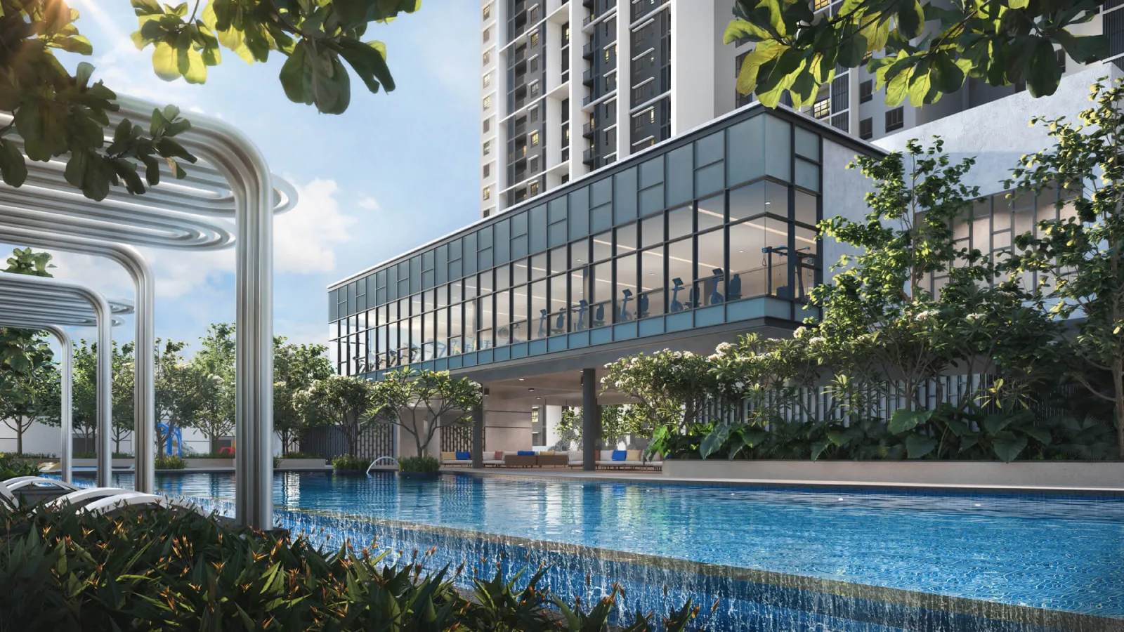 Dek kolam renang Tuju Residences dengan kerusi santai tepi kolam menghadap podium