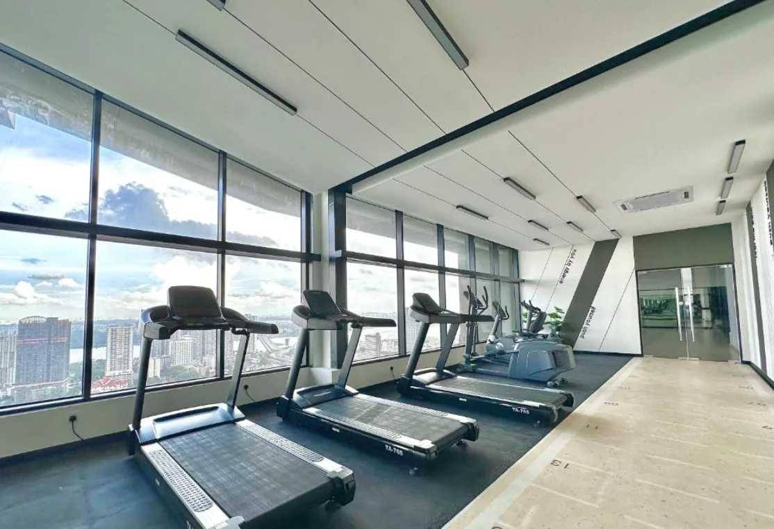 Twin Tower Residence sky gymnasium with treadmills and city skyline view in Bukit Chagar, Johor Bahru, Johor