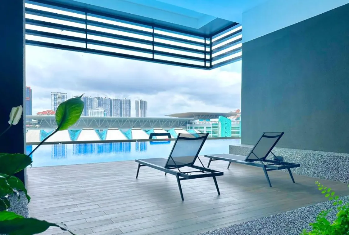 Twin Tower Residence pool deck with sun loungers overlooking the city, Bukit Chagar in Bukit Chagar, Johor Bahru, Johor