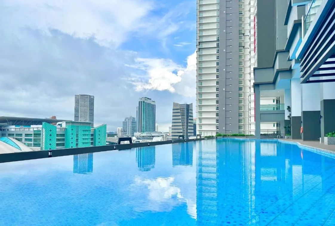 Twin Tower Residence rooftop infinity pool with Johor Bahru skyline reflection in Bukit Chagar, Johor Bahru, Johor